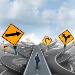 Image of a man navigating the direction to take in starting a small business