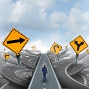 Image of a man navigating the direction to take in starting a small business